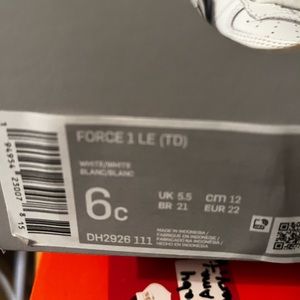 Toddler white Nike gym shoes